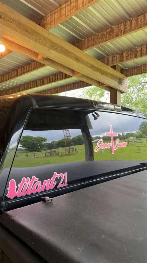 Pink name decal on truck back glass