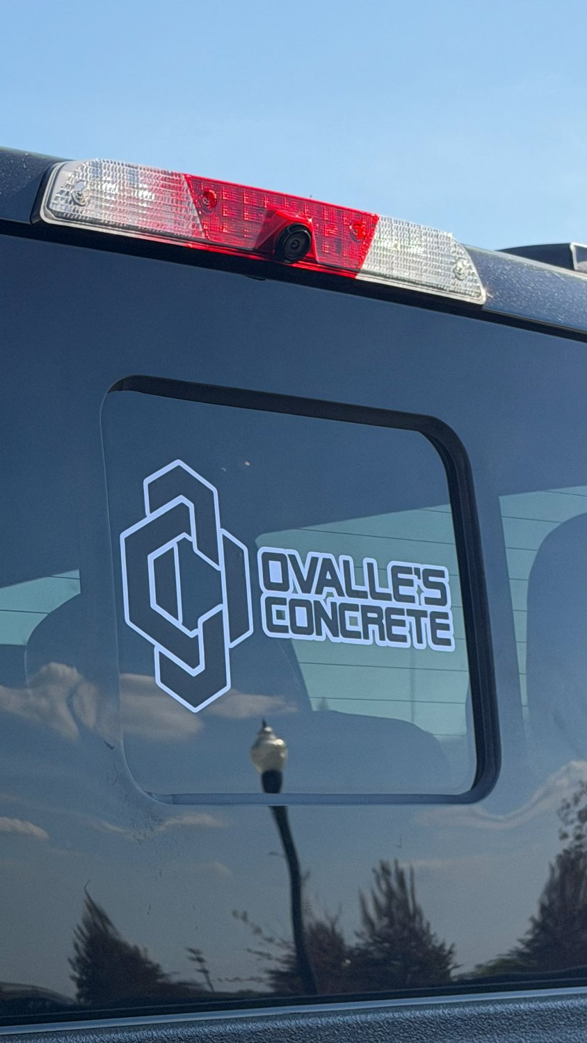Ovalle's Concrete business decal on a truck window
