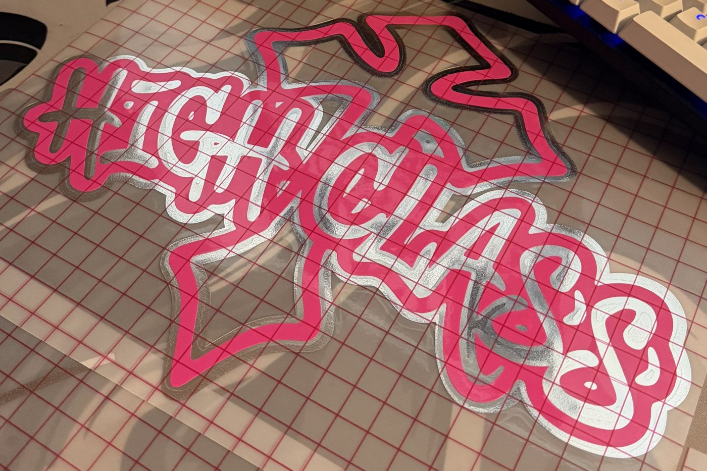 Double-layered chrome and pink club decal
